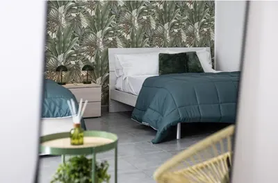 Letto o letti in una camera di Green House Center