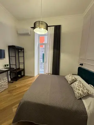 Letto o letti in una camera di La Boutique del Centro