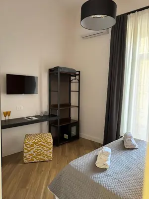 Letto o letti in una camera di La Boutique del Centro