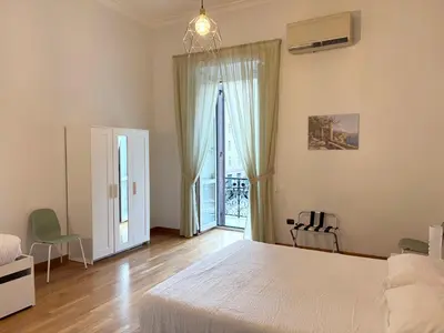 Letto o letti in una camera di Residenza Castel dell'Ovo