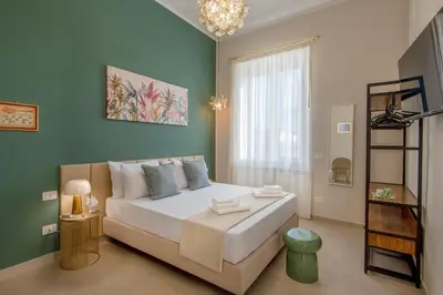 Letto o letti in una camera di Porto Partenope - Exclusive Apartment