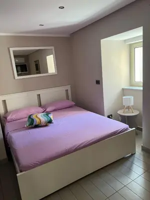 Letto o letti in una camera di Lola suite Napoli