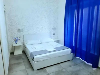 Letto o letti in una camera di Stella Diana