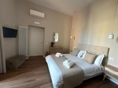 Letto o letti in una camera di Domis Napoli