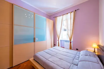 Letto o letti in una camera di Montesanto Flow Flat by Napoliapartments