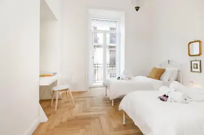 Letto o letti in una camera di Naples Historic Center - 3 Bedroom Apartment by the Duomo Titta & Lello