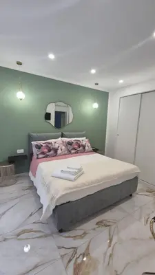 Letto o letti in una camera di DEA Suite & Garden