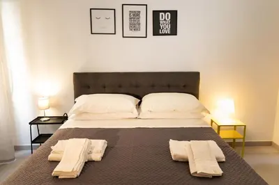 Letto o letti in una camera di Dimora Perfetto