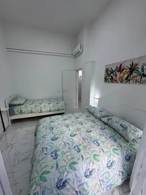 Letto o letti in una camera di Residenza Castel Capuano