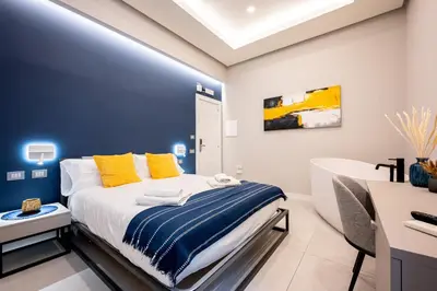 Letto o letti in una camera di Plebiscito Luxury Guest House