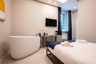 Letto o letti in una camera di Plebiscito Luxury Guest House