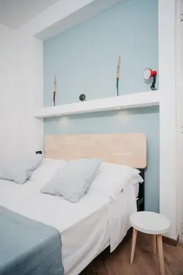 Letto o letti in una camera di CasaNapoletana Charme&Garden Al Corso