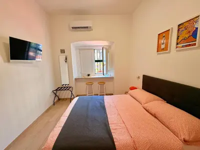 Letto o letti in una camera di A casa di Luca Napoli