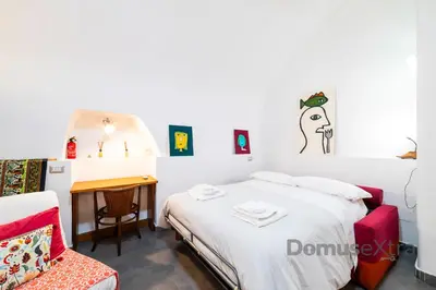 Letto o letti in una camera di Gatto Giallo a Chiaia By DomusExtra