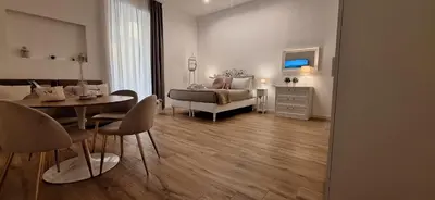 Letto o letti in una camera di L'AMI Chiaia Suite