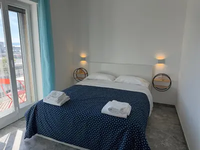 Letto o letti in una camera di Napoli Mood Rooms