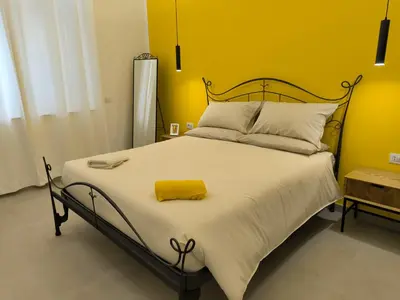 Letto o letti in una camera di Il Golfo di Pulcinella