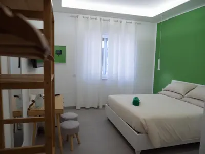 Letto o letti in una camera di Il Golfo di Pulcinella
