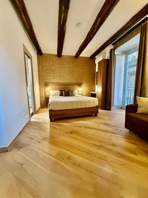Letto o letti in una camera di Bella Mbriana Napoli Rooms