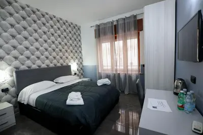 Letto o letti in una camera di BeB Napoli la perla
