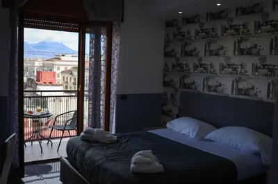 Letto o letti in una camera di BeB Napoli la perla