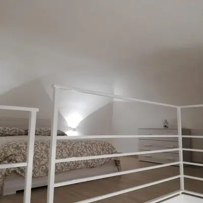 Letto o letti in una camera di MarcoHomeChiaia