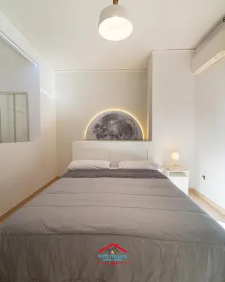 Letto o letti in una camera di Suite Stellata Napoli home in the center