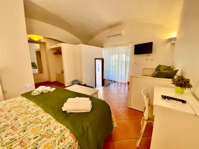 Letto o letti in una camera di Borgo Belvedere