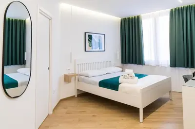 Letto o letti in una camera di NOUS Boutique Suites