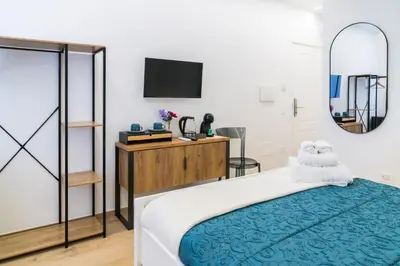 Letto o letti in una camera di NOUS Boutique Suites