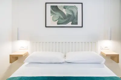 Letto o letti in una camera di NOUS Boutique Suites