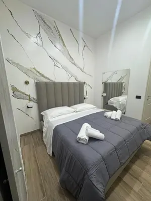 Letto o letti in una camera di Maison Ecce Hom0