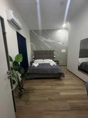 Letto o letti in una camera di Maison Ecce Hom0