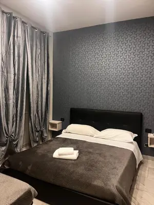 Letto o letti in una camera di Hotels Int&rnational Napoli