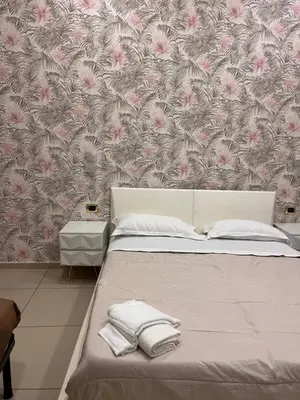 Letto o letti in una camera di Hotels Int&rnational Napoli