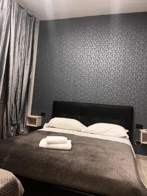 Letto o letti in una camera di Hotels Int&rnational Napoli