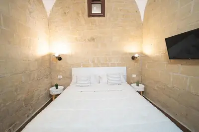Letto o letti in una camera di Ognibene Nest by Wonderful Italy