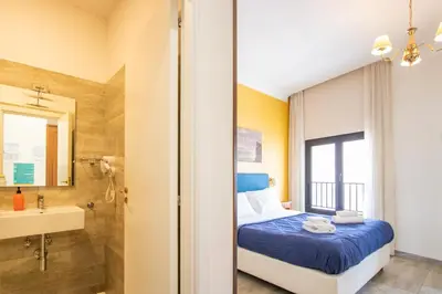 Letto o letti in una camera di NeapolitanTrips Hotel