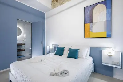 Letto o letti in una camera di Mo' Vediamo rooms