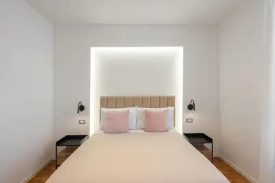 Letto o letti in una camera di Casa Mama - Dimore Partenopee