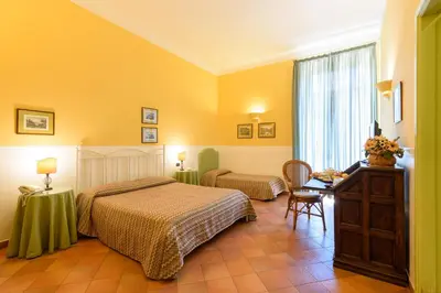 Letto o letti in una camera di Hotel Mergellina