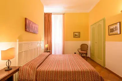 Letto o letti in una camera di Hotel Mergellina