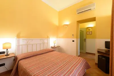 Letto o letti in una camera di Hotel Mergellina