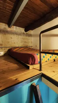 Letto o letti in una camera di Magma Home - Rooms & Roof