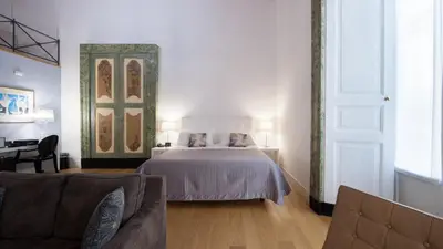 Letto o letti in una camera di Santa Chiara Boutique Hotel
