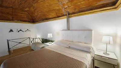 Letto o letti in una camera di Santa Chiara Boutique Hotel