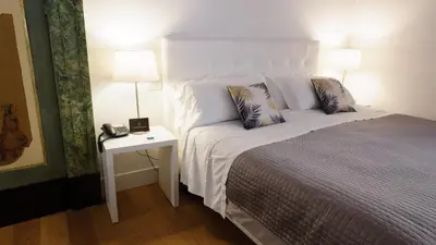 Letto o letti in una camera di Santa Chiara Boutique Hotel