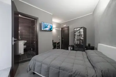 Letto o letti in una camera di Il Taschino Suite