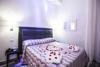 Letto o letti in una camera di Napoli Garibaldi Square