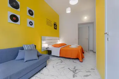 Letto o letti in una camera di Colori e Note
